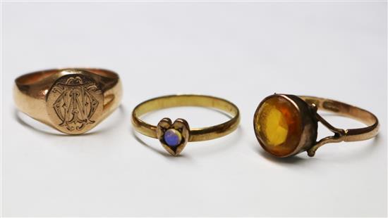A 9ct gold signet ring and two other gold rings.